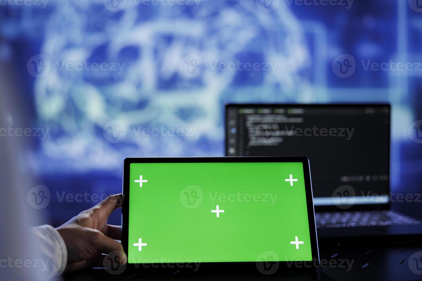 Admin writes code on green screen tablet to visualize artificial intelligence neural networks using augmented reality. High tech workspace supervisor runs AI script on chrome key device photo