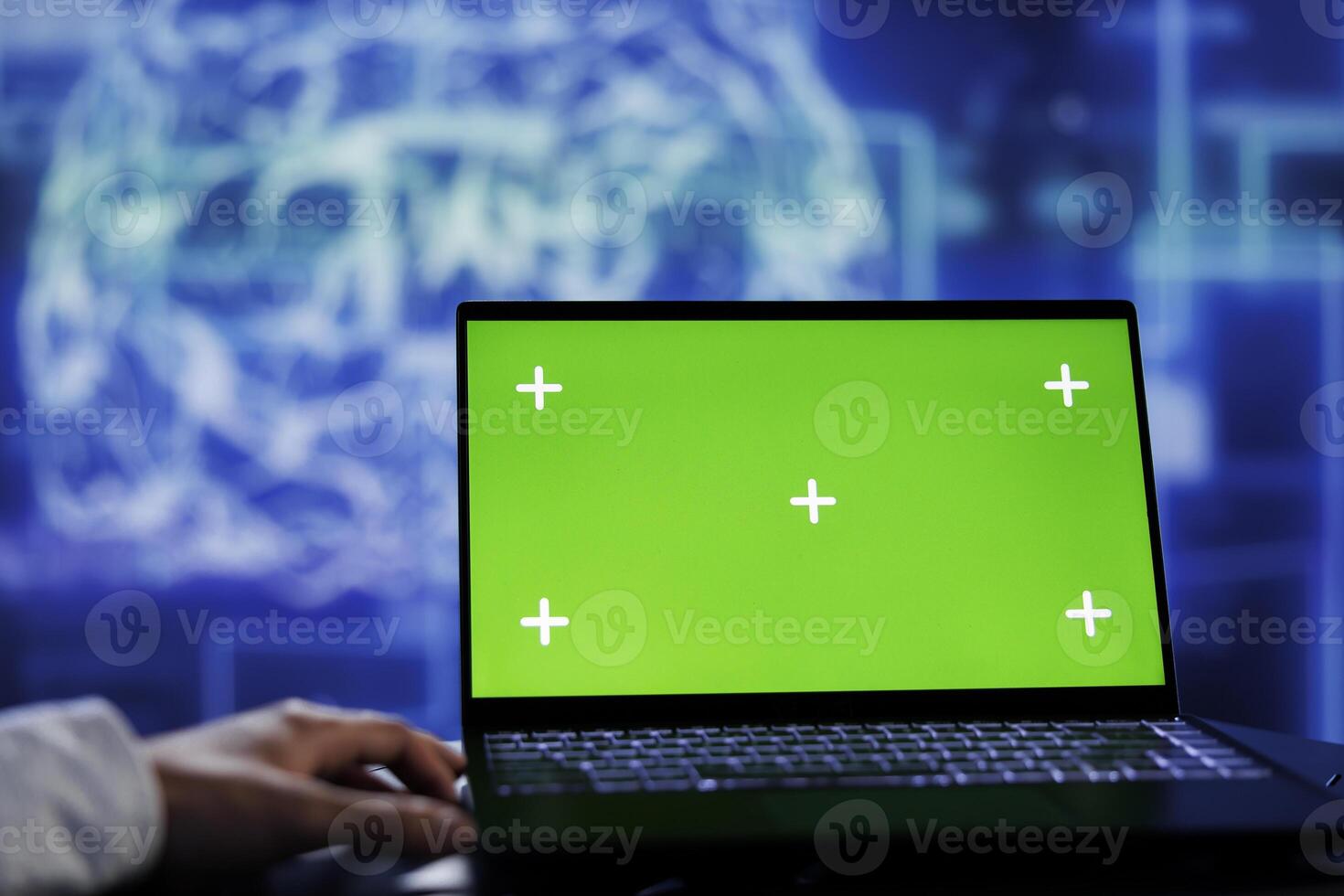 Admin using green screen device for artificial intelligence computing simulating human brain through self learning algorithms. Employee with chrome key laptop, working with AI deep neural networks photo