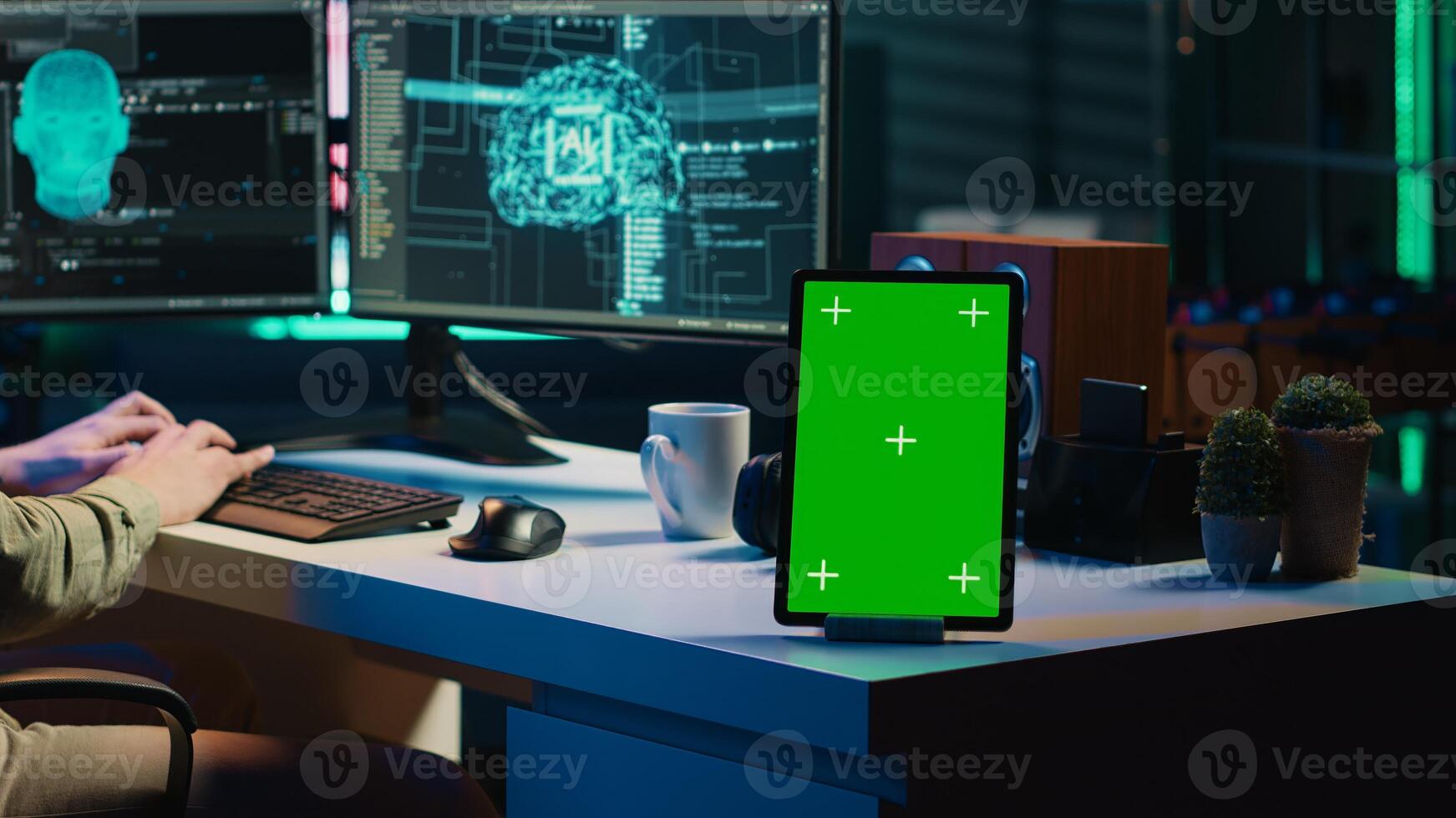 Focus on isolated screen tablet next to programmer updating artificial intelligence, making it become sentient. IT specialist programming self aware AI with chroma key device, camera A photo