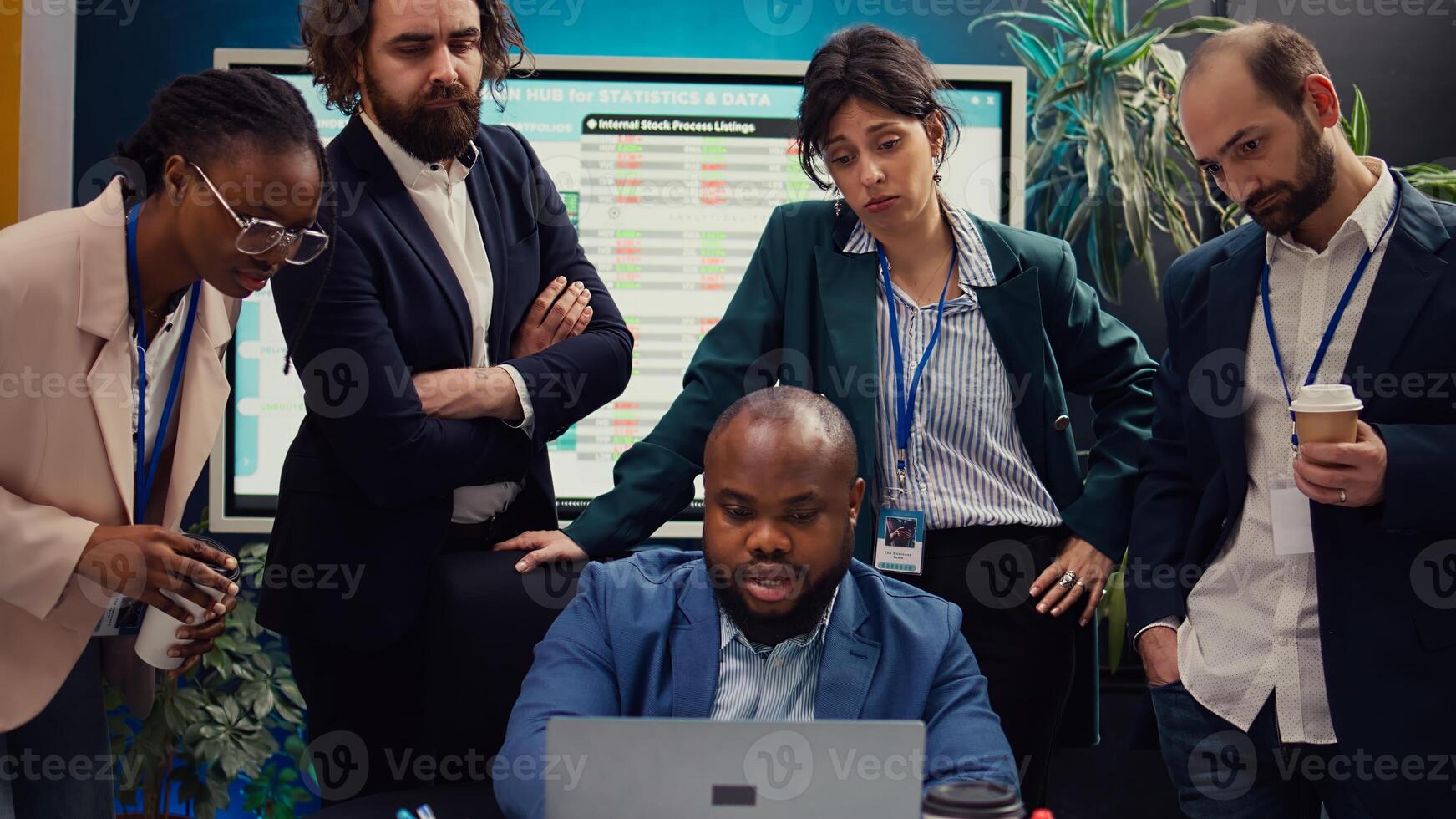 Sales team reviewing market trends and statistics in a boardroom, meeting to create a report for the new marketing strategy. Employees participants brainstorm innovative ideas. Camera B. photo