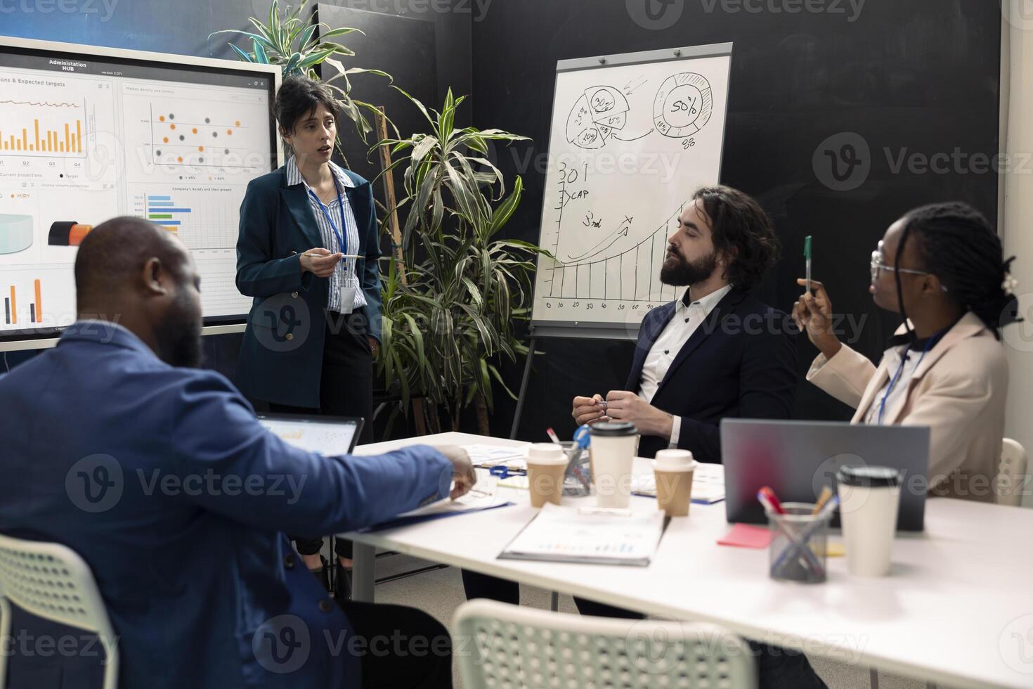 Colleagues creating innovation initiatives in research and development efforts, making new plans and strategies to ensure objectives achievement within the firm. Market supply and demands. photo