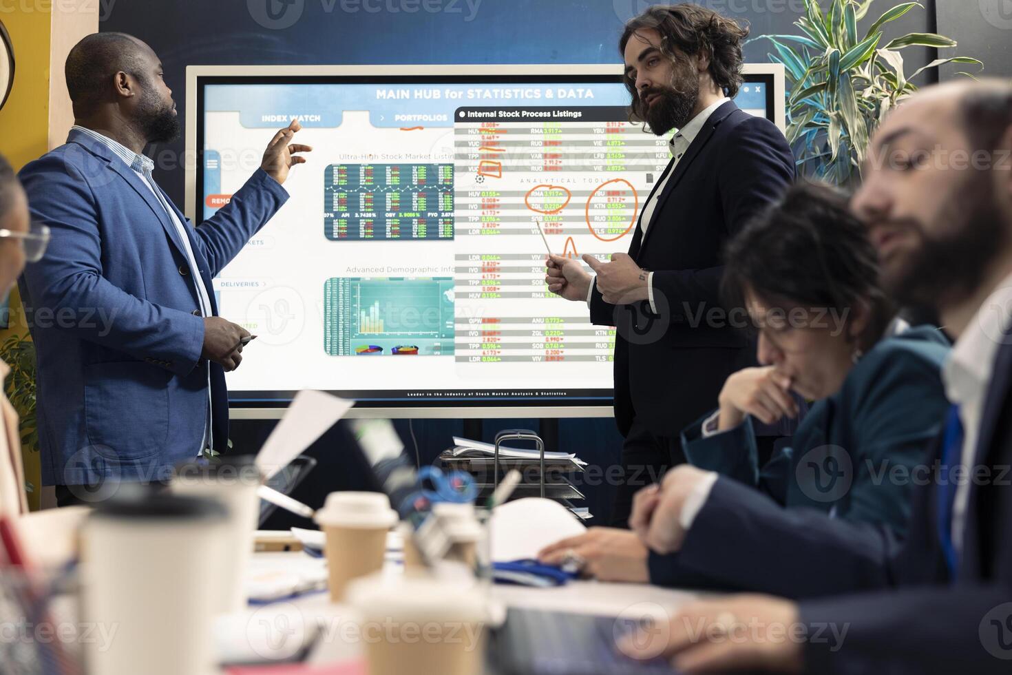 Marketing assistant evaluating sales and revenue within infographics data, coworkers sharing insight in a briefing meeting. Staff members planning promotional campaigns for a better public image. photo