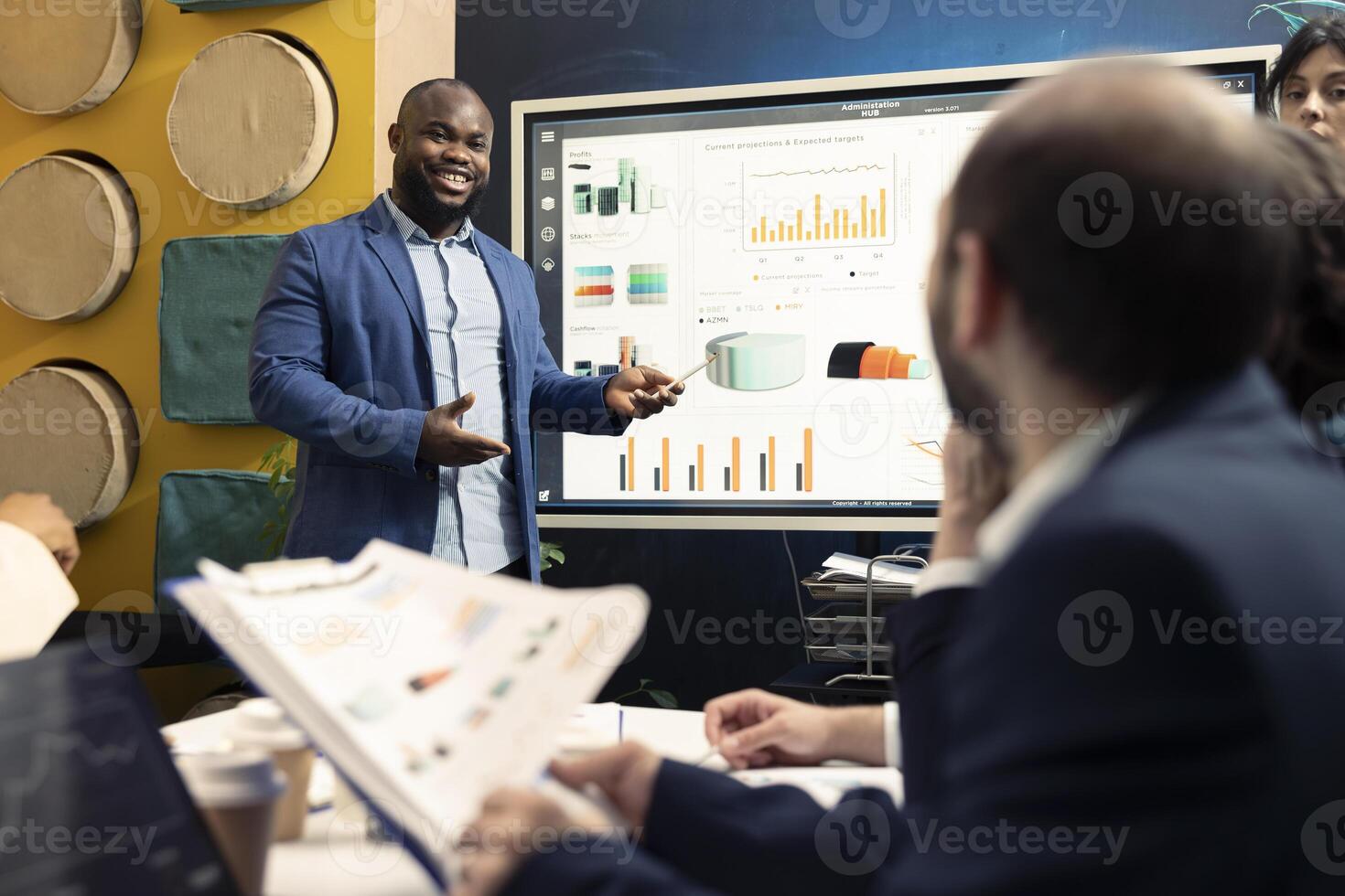 Sales representative examine financial reports and success metrics with archived infographics, looking for corporate expansion opportunities. Training to become a multinational organization. photo