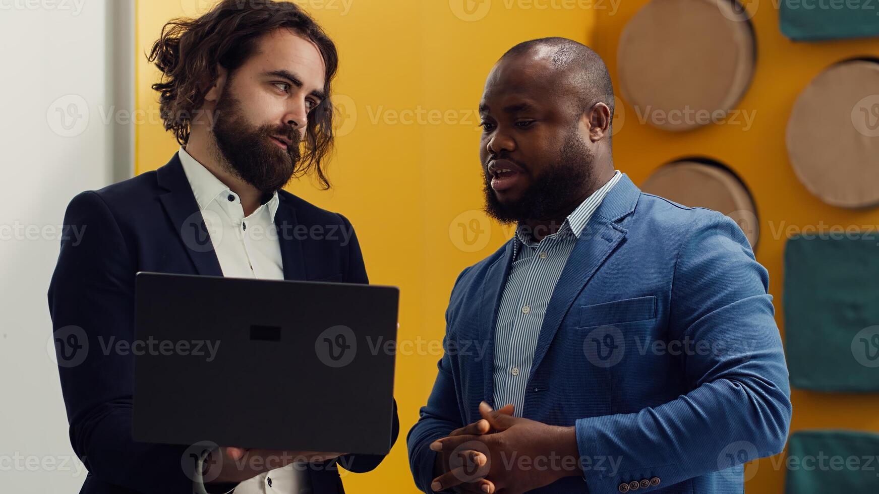 Business partners analyzing performance metrics within the organization. Conduct employee evaluations and discuss training to foster professional development and enhance team productivity. Camera A. photo