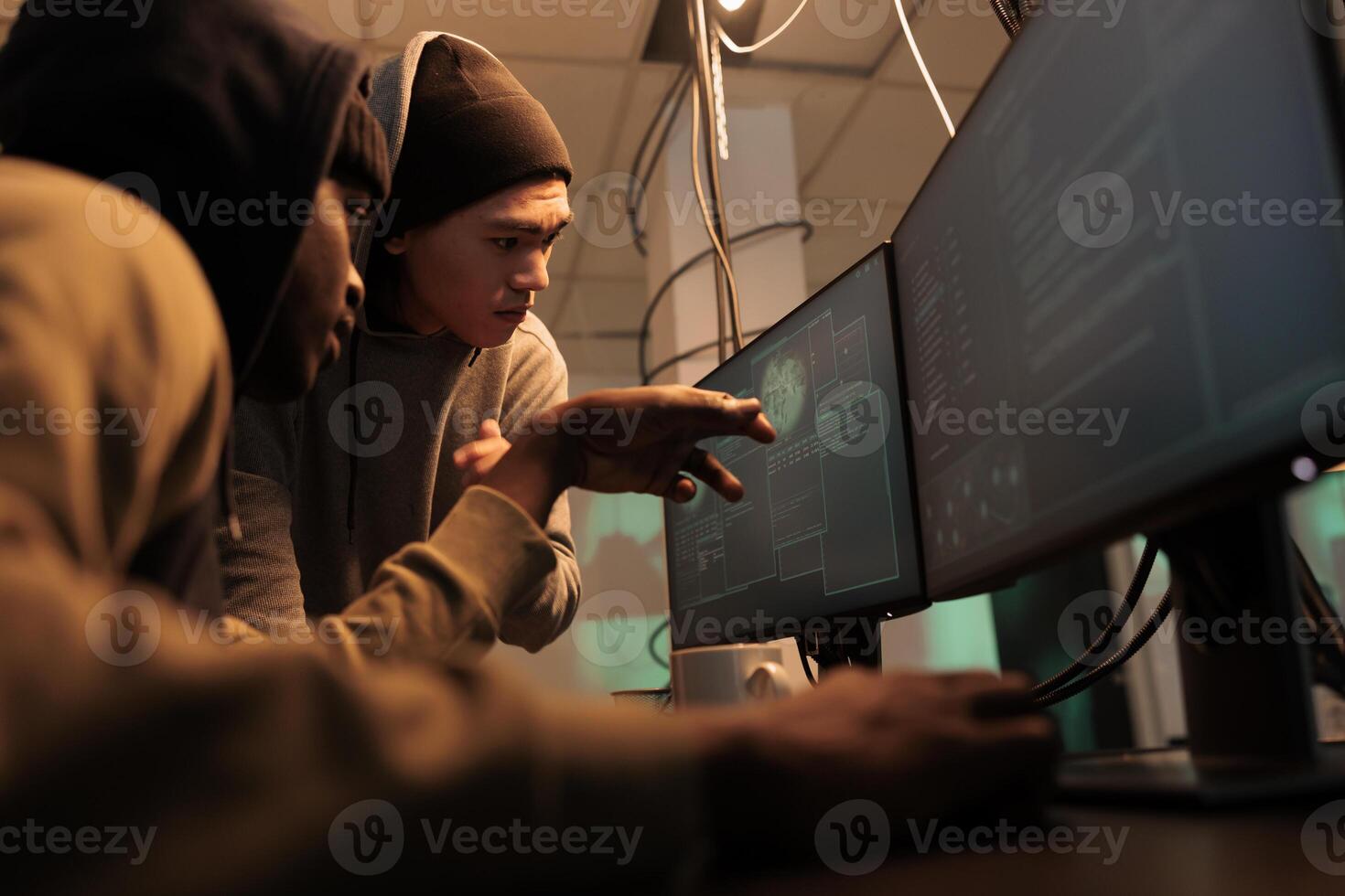 Hackers discussing computer system password cracking, coding malware, cybercrime. Criminals developing internet virus, scammers programming malicious software at night time photo