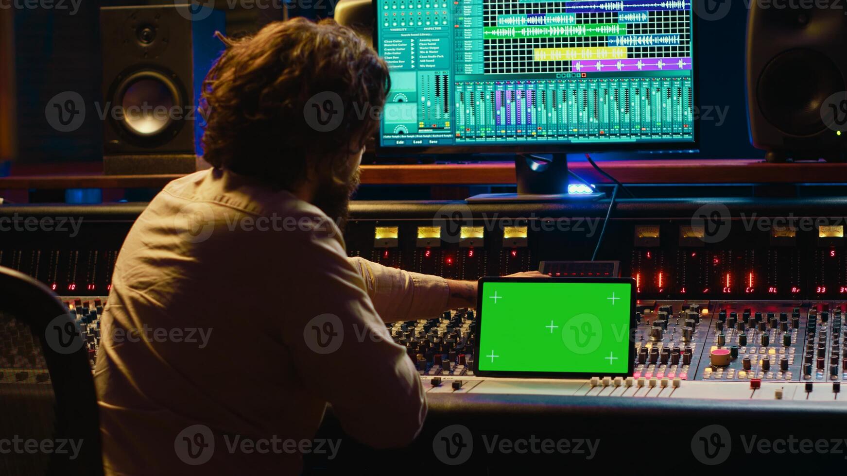 Audio technician working with music recording software and editing tunes, mixing console and control panel board in post production studio. Producer operating technical equipment. Camera A. photo