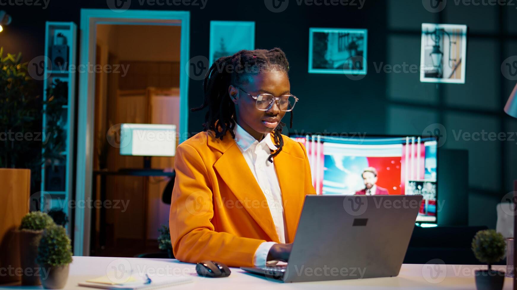 University student organizing study schedules and timelines to attend all important online courses, remote work. African american girl participating in workshops or training sessions. Camera B. photo