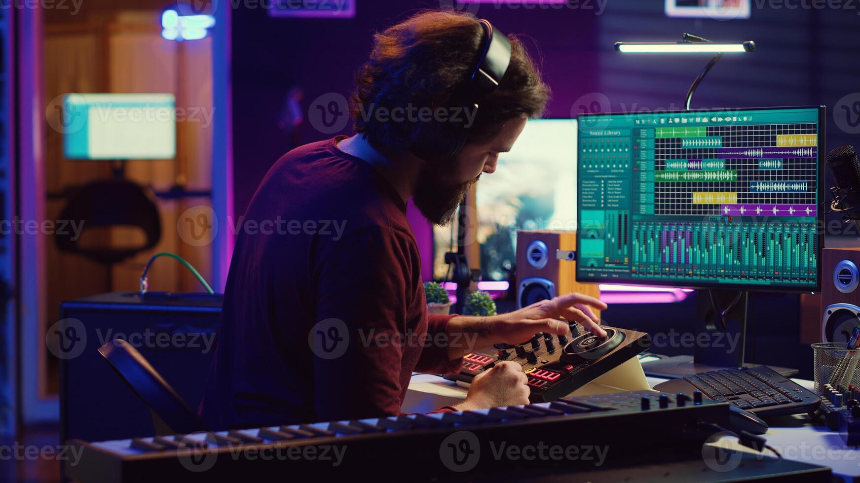 Music engineer using usb stick to edit and add sound effects on audio recording, adjusted volume levels. Artist doing mixing and mastering technique on soundboard, plays piano. Camera A. photo