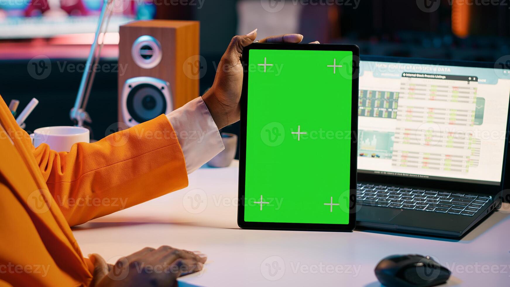 African american girl holding tablet with greenscreen layout, conducting data analysis for financial or economics courses. Student uses isolated mockup display on device, work from home. Camera A. photo