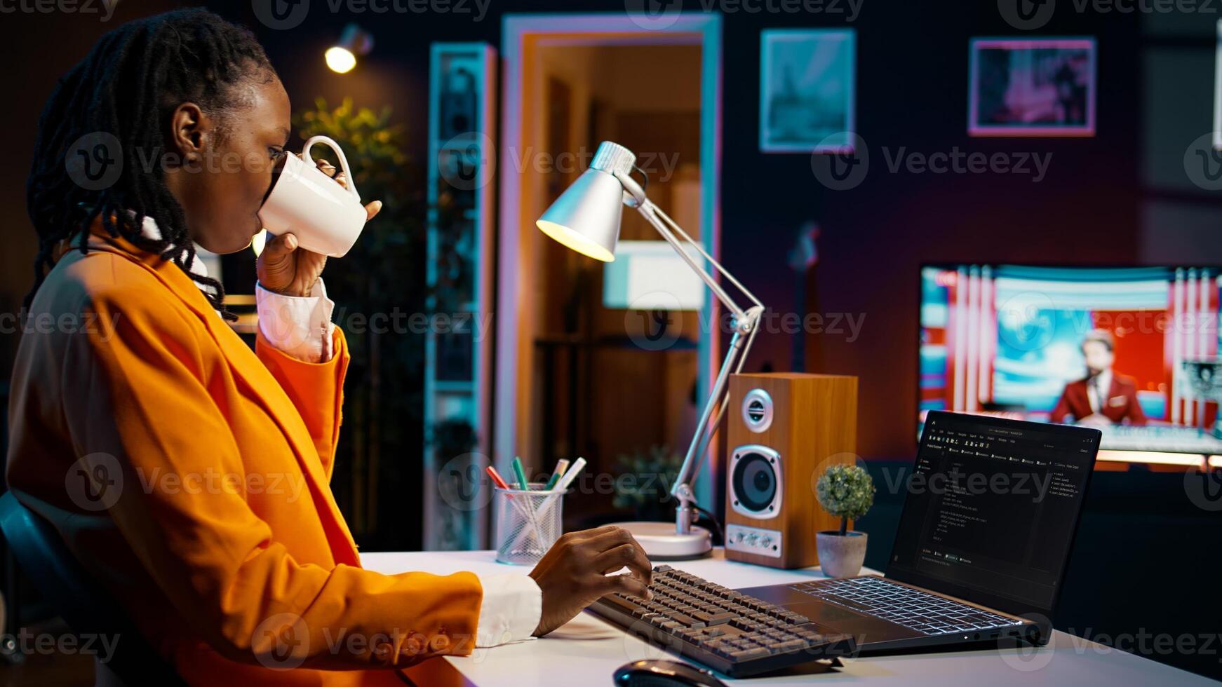 African american IT student practicing coding or programming exercises, learning hardware language and system debugging. Young woman studying database script on html window. Camera B. photo