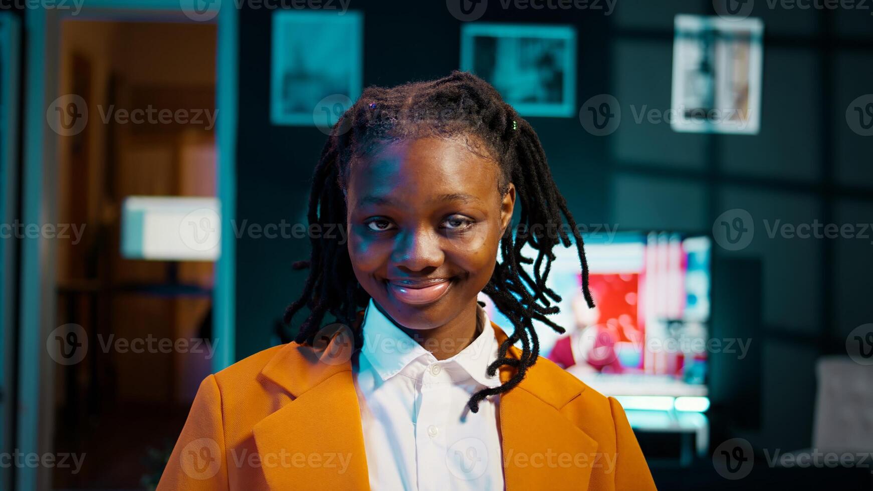 Portrait of university student participating in e learning courses, reviewing lesson materials and lecture notes at home office. Dedicated girl writing ideas for future exams or tests. Camera B. photo