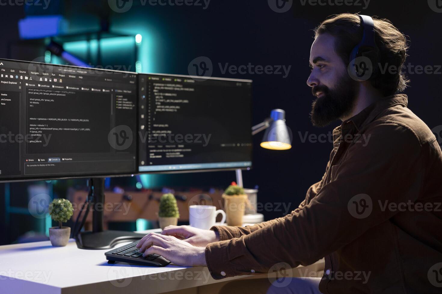 Freelancing programmer hearing audiobooks while designing and developing software applications. IT specialist enjoying podcasts while implementing and maintaining company systems photo