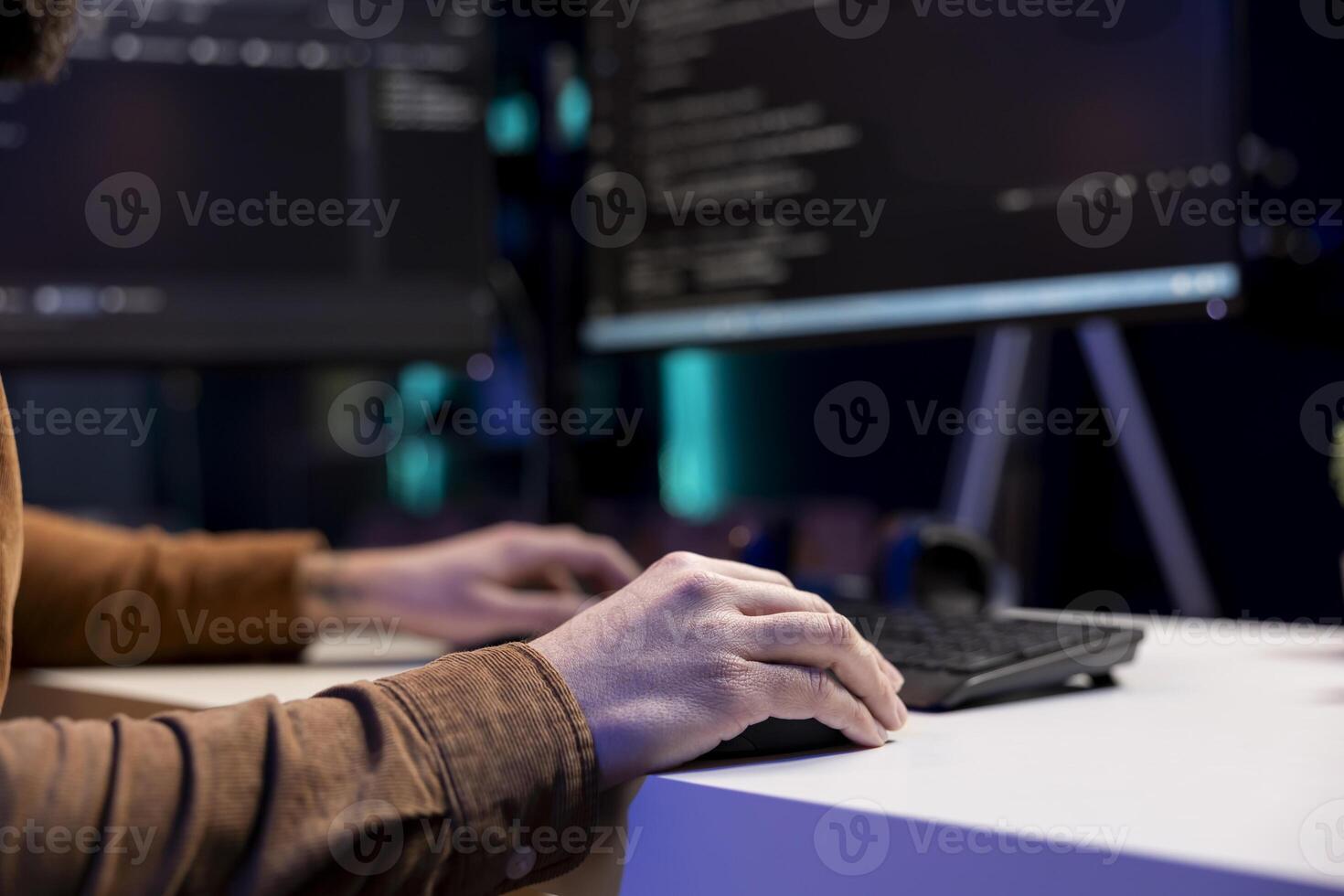 Freelancing cybersecurity admin using computer to look for company security vulnerabilities. IT engineer typing on keyboard, installing fortified code on PC to prevent cyber attacks, close up photo