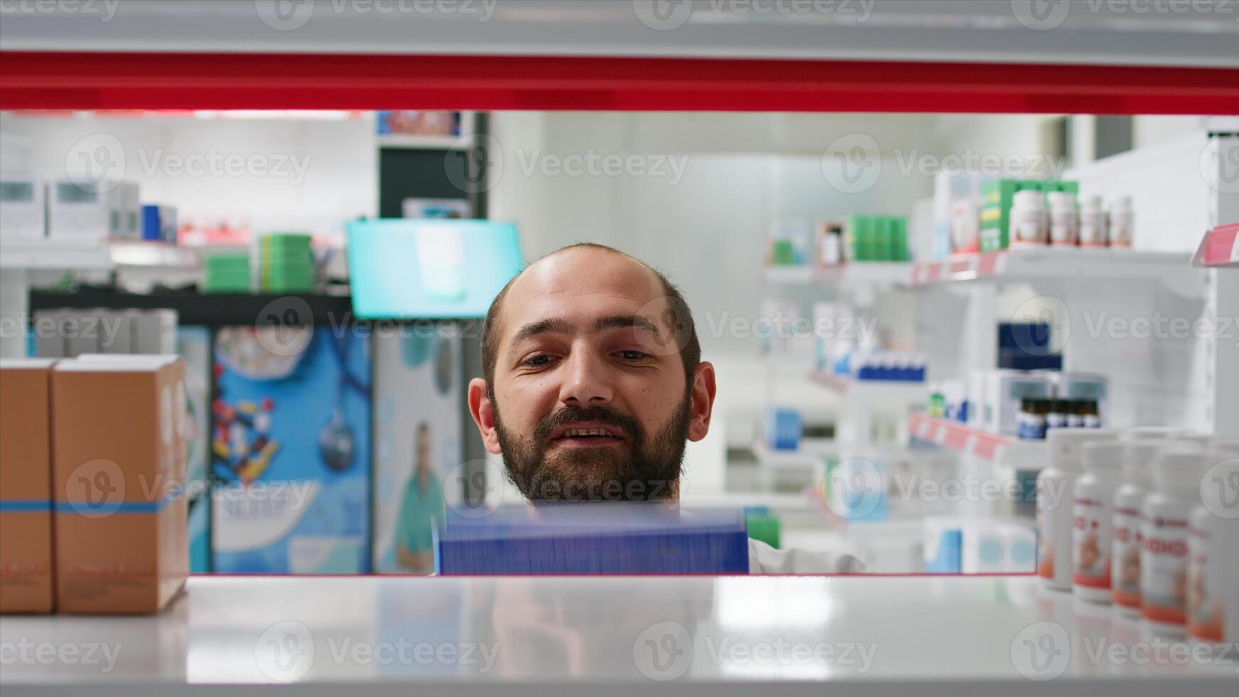 POV of pharmacist placing medicaments boxes on shelves, organizing types of medicine in pharmacy. Medical assistant putting supplements or treatments on prescription, insurance services. Tripod shot. photo