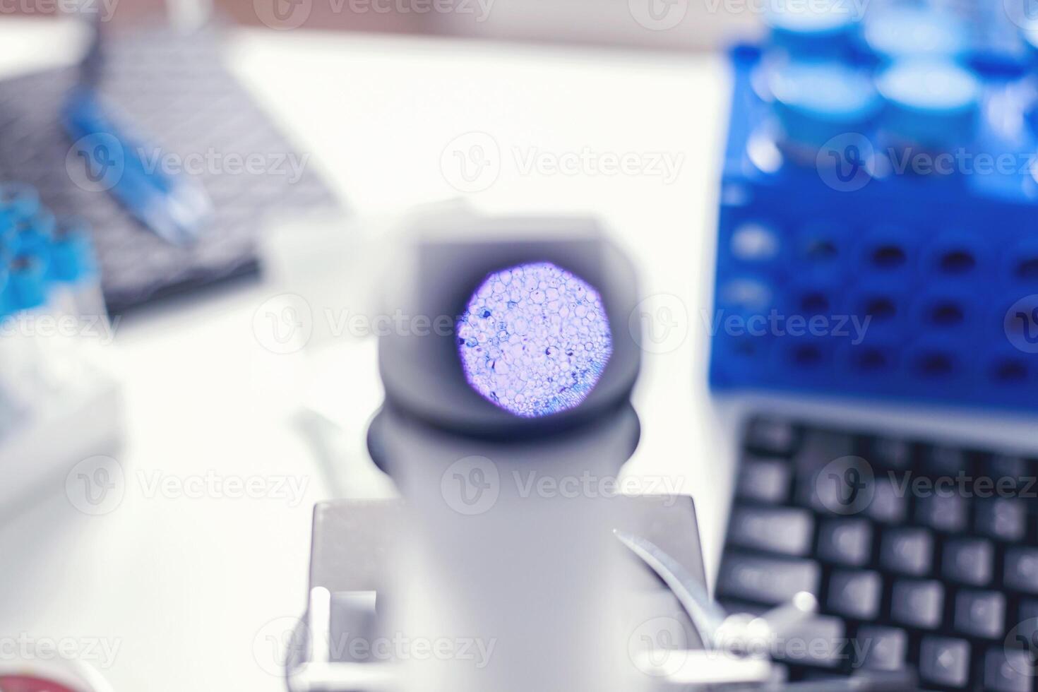 Close up view of cells through microscope in modern medicine laboratory. Micrograph of medical science stratified squamous epithelium tissue cell photo