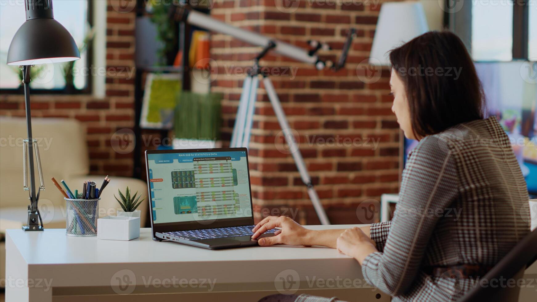 Remote stockholder analyzing investment financial profit by looking at market shares graphs. Professional broker investor checking stock exchange valuation while working from home, camera B photo