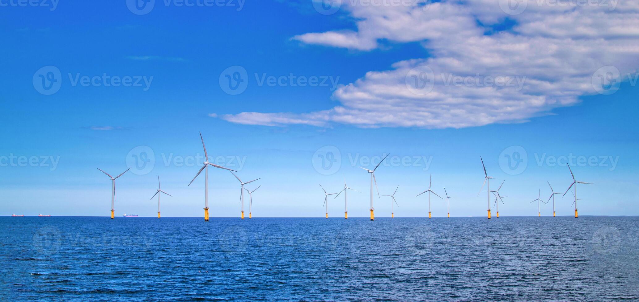 Offshore Wind Turbine in a Windfarm under construction off the England Coast photo