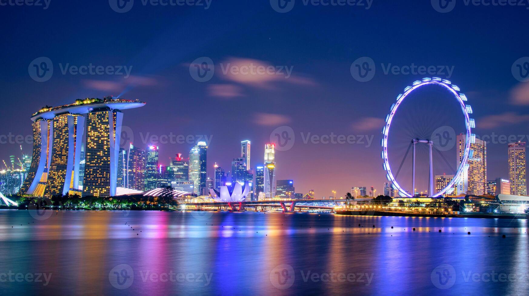 Singapore Skyline and view of skyscrapers on Marina Bay at twilight time. photo