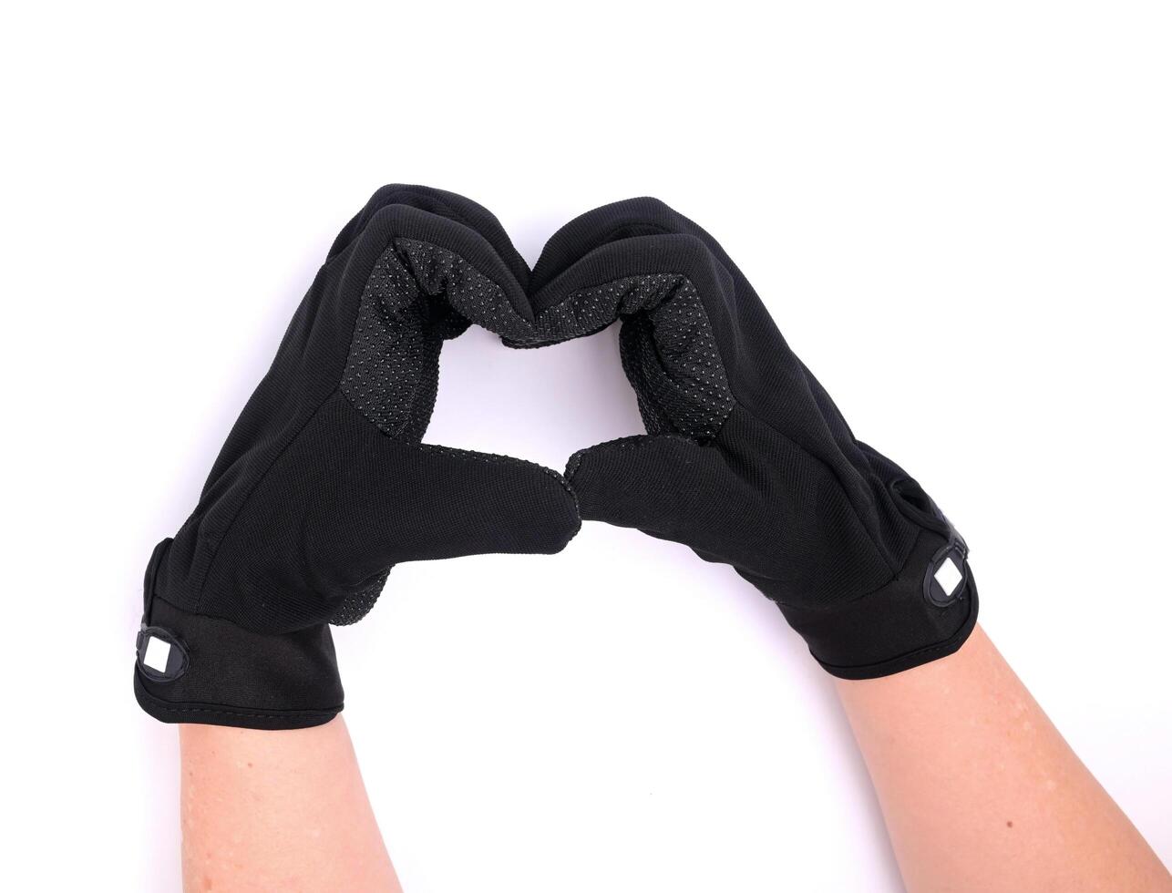 Black cloth palm gloves with anti-slip grip, isolated on white background. photo