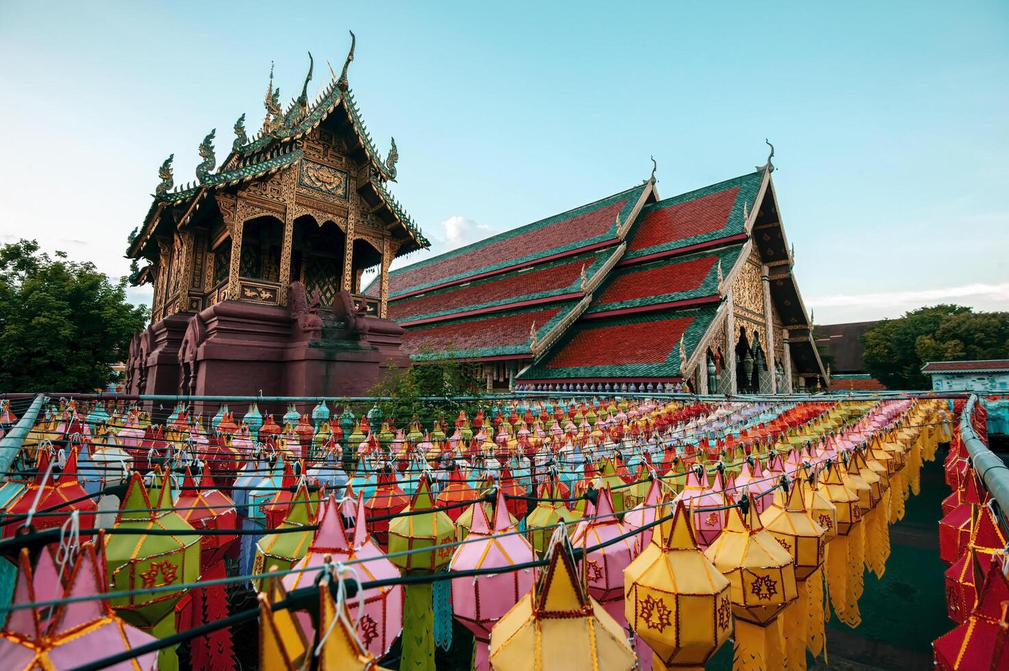Lanterns made of colorful paper are hung during the annual festival at Wat Phra That Hariphunchai in Lamphun Province. photo