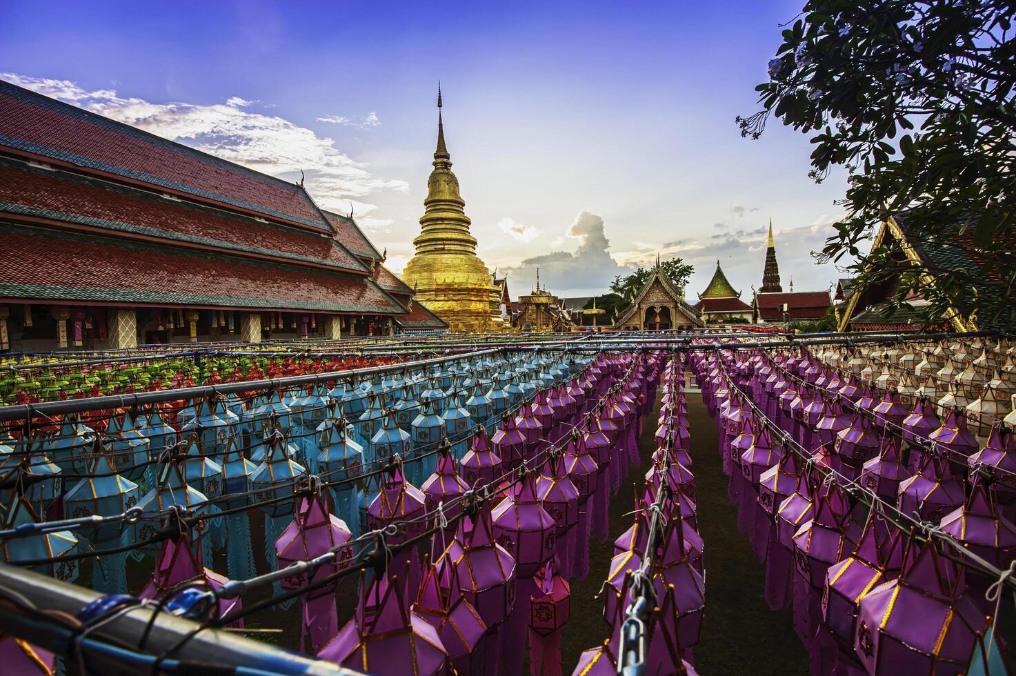 Lanterns made of colorful paper are hung during the annual festival at Wat Phra That Hariphunchai in Lamphun Province. photo