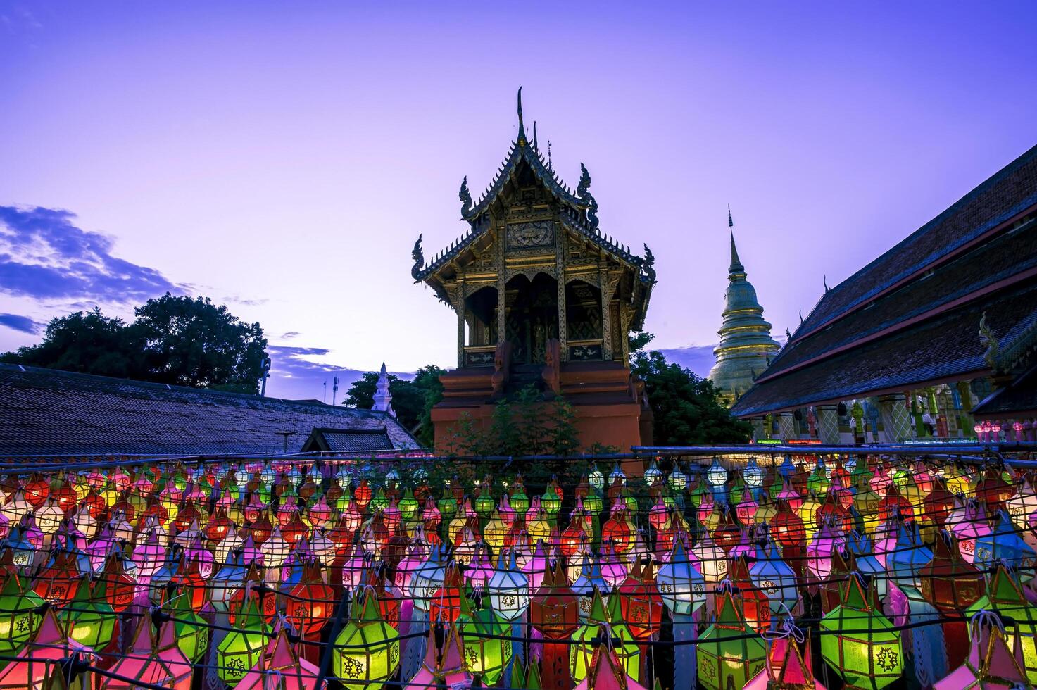 Lanterns made of colorful paper are hung during the annual festival at Wat Phra That Hariphunchai in Lamphun Province. photo