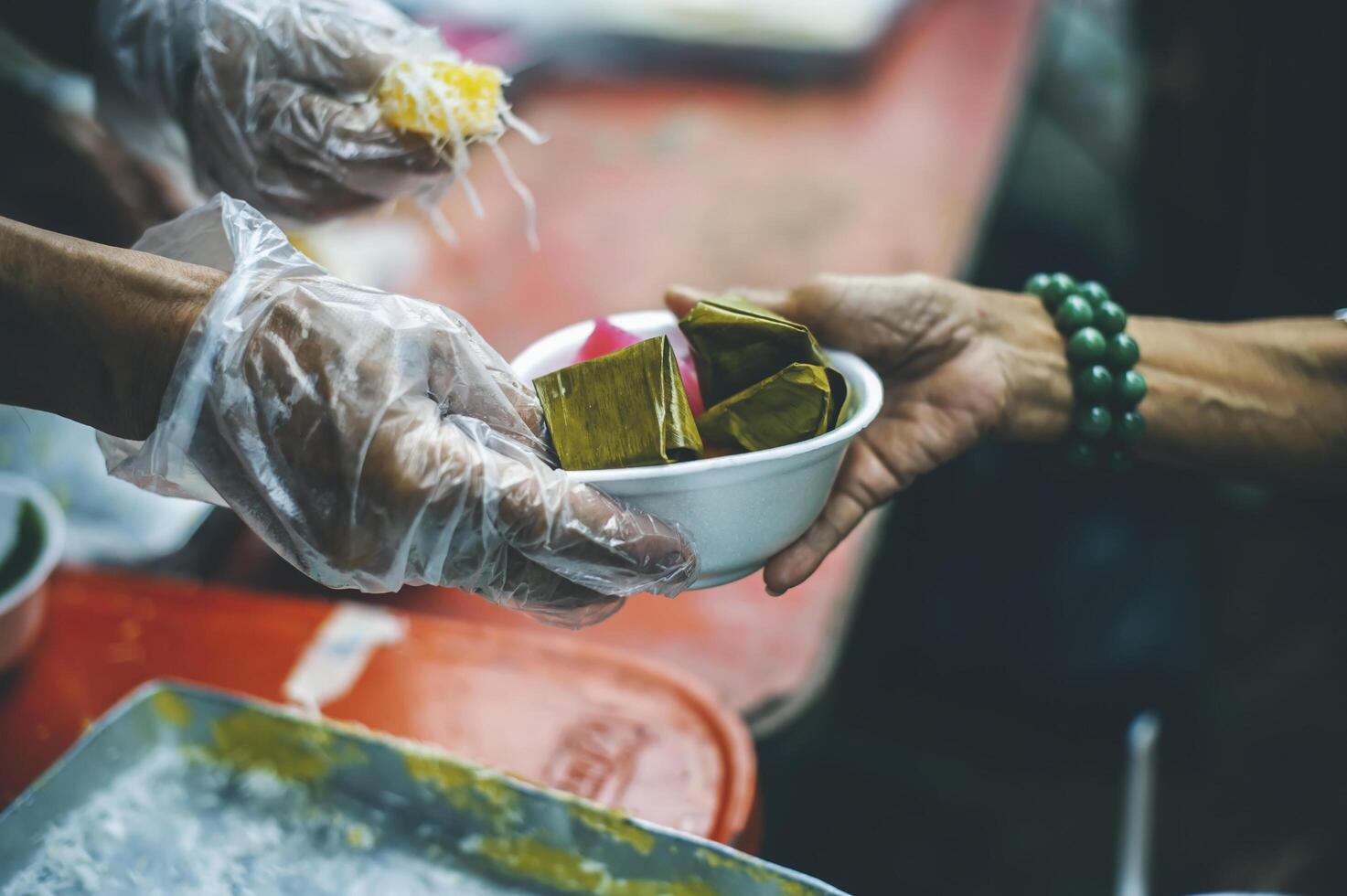 Food assistance to the homeless poor from volunteers concepts of public hunger. photo