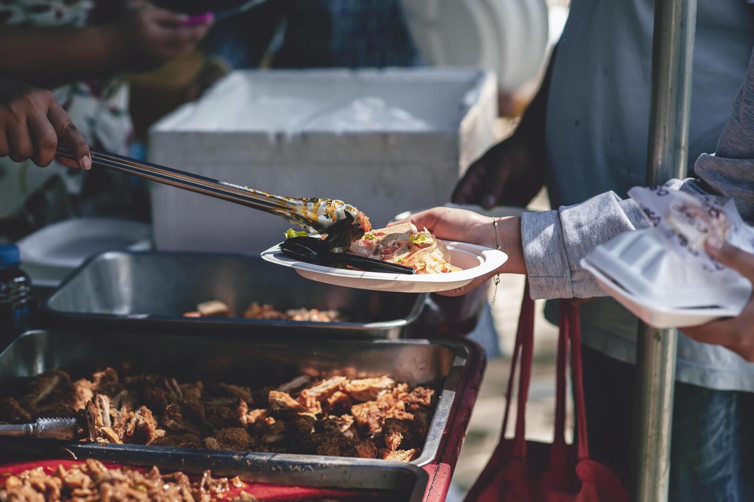 From hand to hand. Sharing Food With Homeless photo