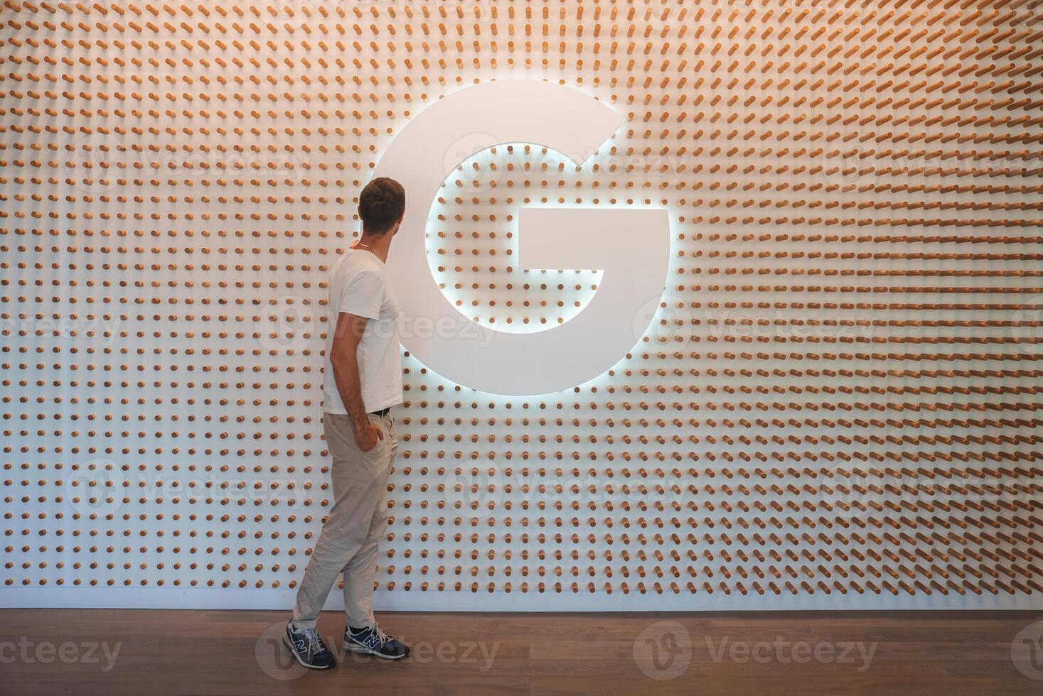 Modern Interior Design with Illuminated Letter G Focal Point photo