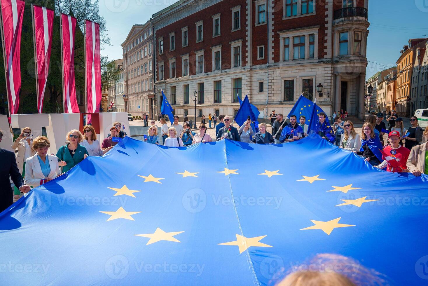 Vibrant Celebratory Scene in Old Town Riga, Latvia photo