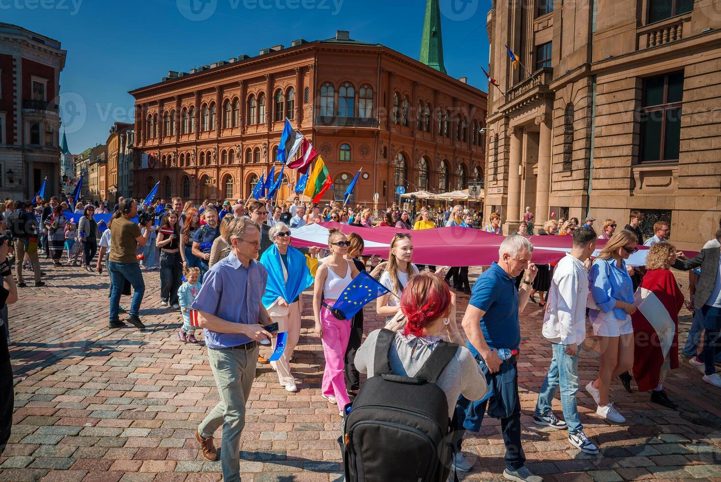 Vibrant celebration in Riga's old town square, Latvia photo