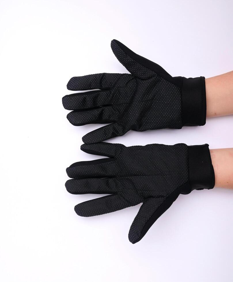 Black cloth palm gloves with anti-slip grip, isolated on white background. photo