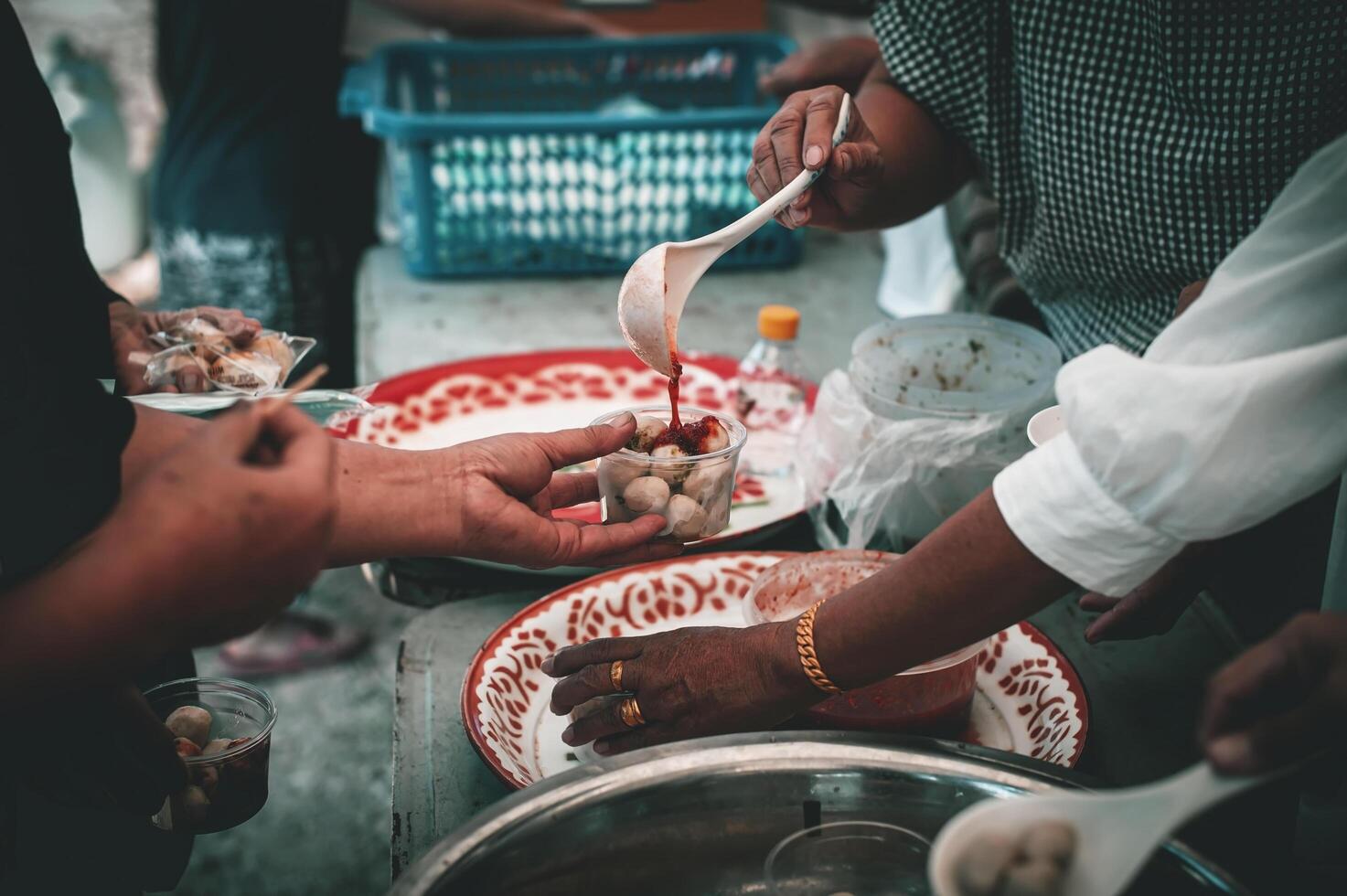 Volunteers offer free food to the poor. the concept of food sharing. photo