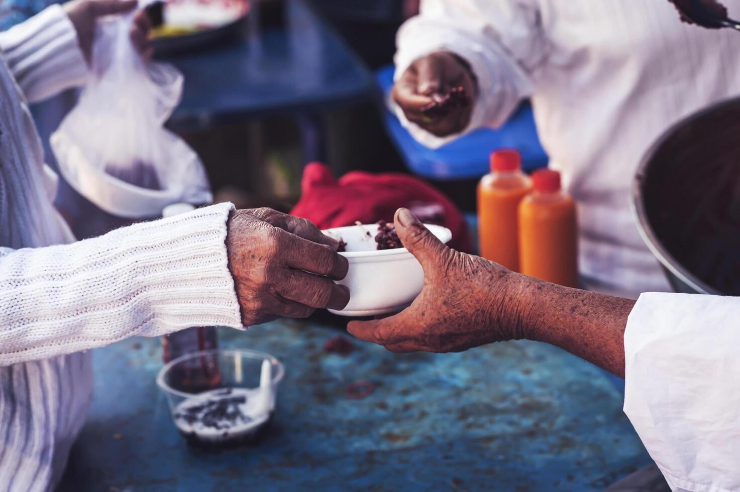 Food assistance to the homeless poor from volunteers concepts of public hunger. photo