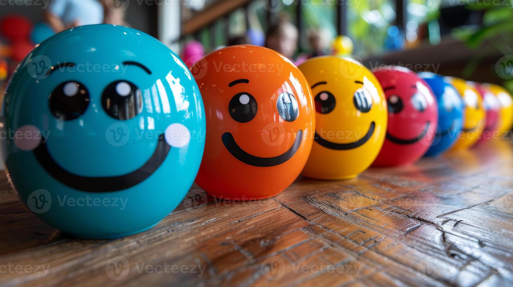Colorful Emoticon Balls Lined Up on Wooden Table in a Row for Interactive Activities photo