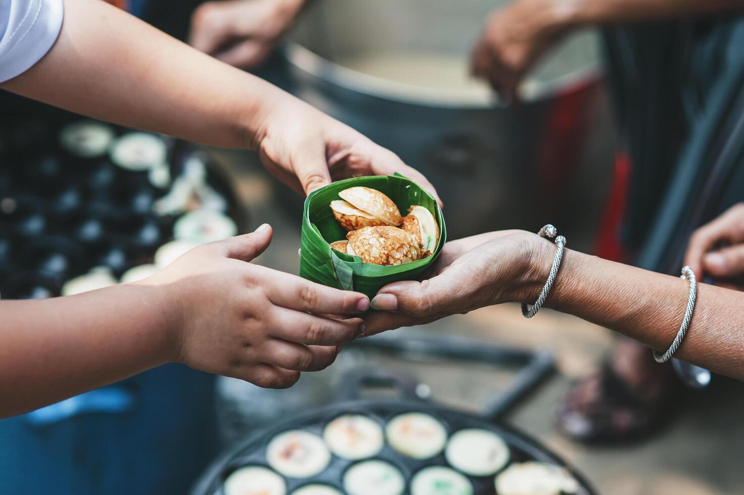 Volunteers serving hot meals to hungry migrants humanitarian aid concept. photo