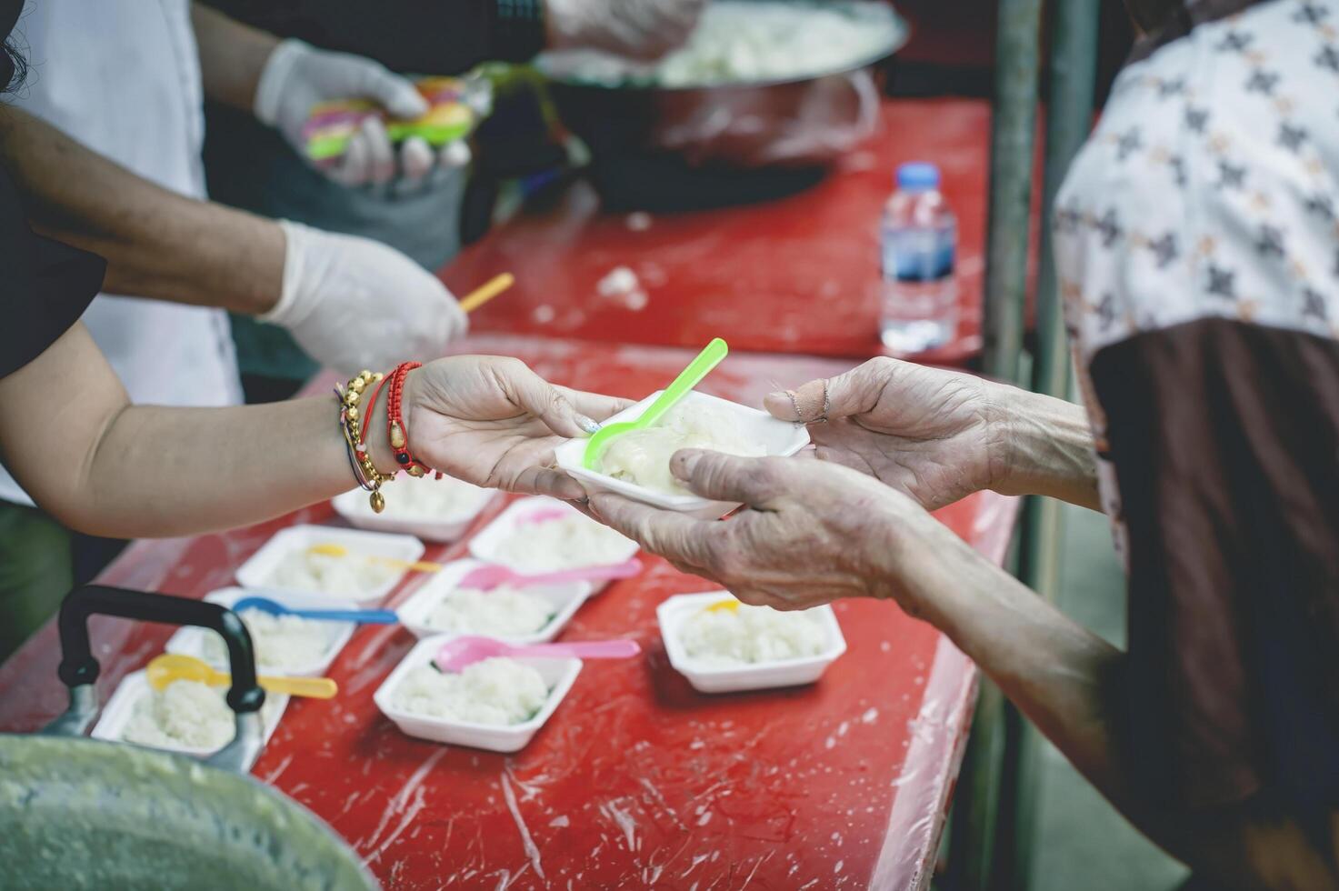Food donations to fight hunger by sharing free food with people photo