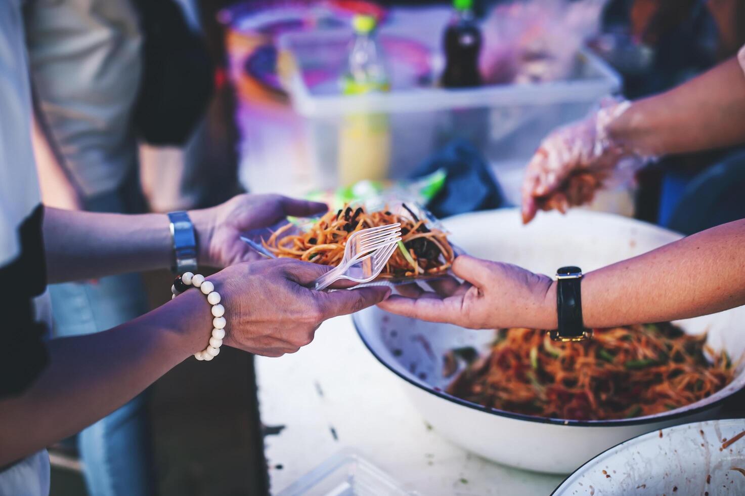 Hungry homeless people request free food donations from volunteers social concept of helping photo
