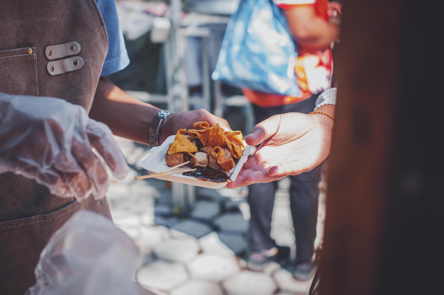 Hungry homeless people request free food donations from volunteers social concept of helping photo