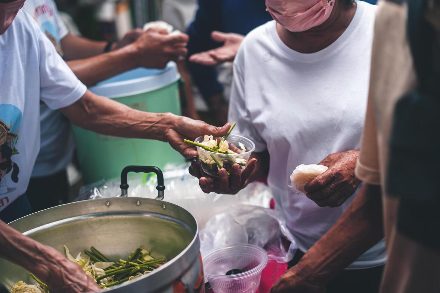 Food assistance to the homeless poor from volunteers concepts of public hunger. photo