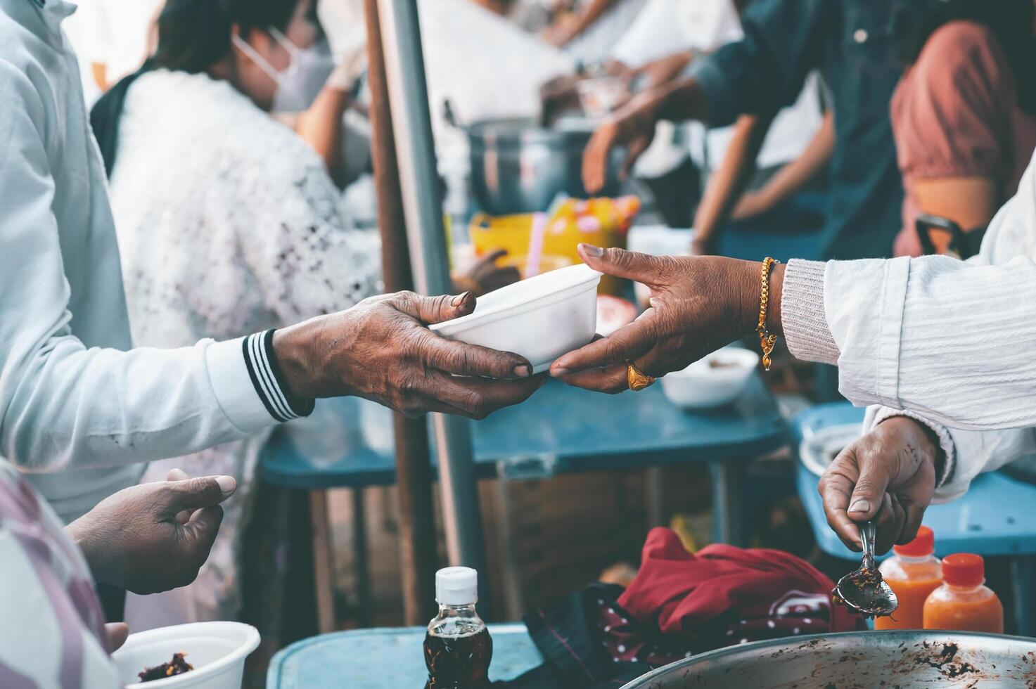Food assistance to the homeless poor from volunteers concepts of public hunger. photo