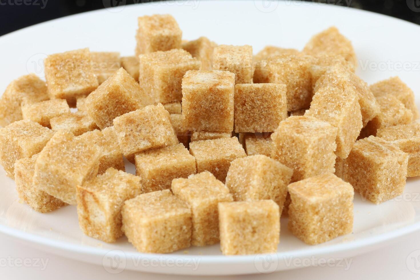 Lots of brown sugar cubes. photo