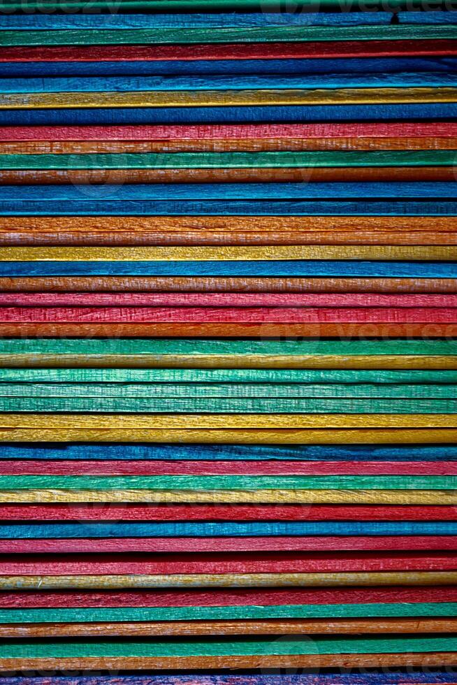 Multi colored wooden craft sticks, colorful background photo