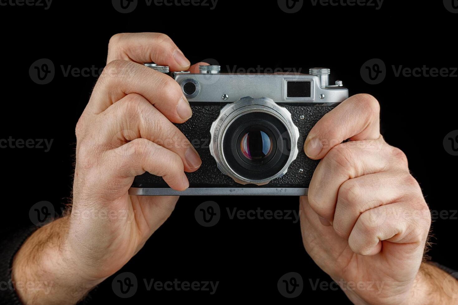 Old retro camera in hands photo