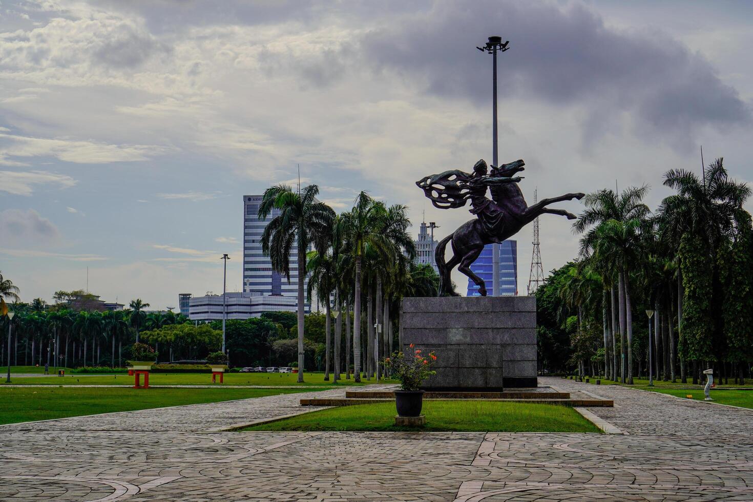 Central Jakarta, January 30, 2024 - Diponegoro statue riding a horse on the grounds of the Jakarta National Monument, Indonesia. photo