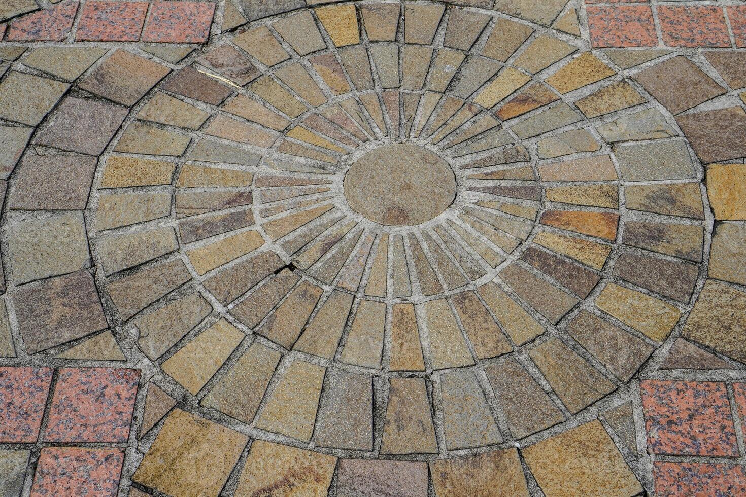 top view of the floor with natural stone neatly arranged with circular dots at the posts photo