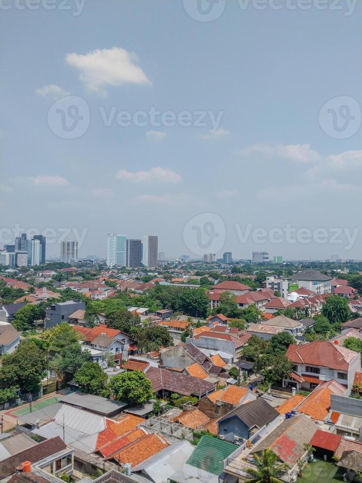 top view of people's houses with skyscrapers looking far away. photo