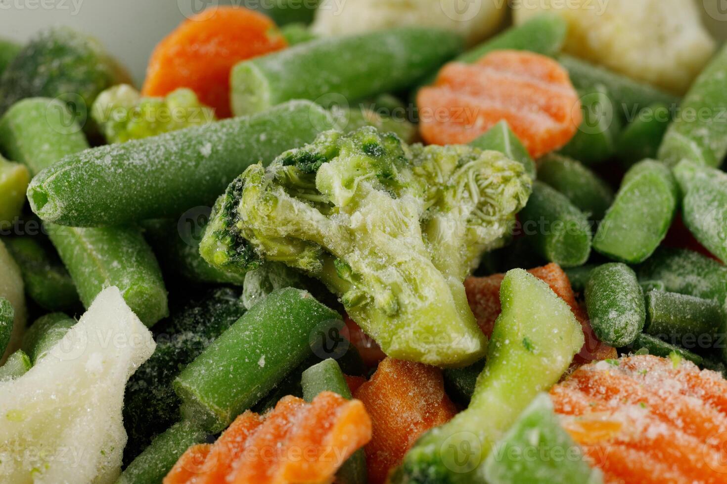 Frozen vegetables close-up. Vegetables in the fridge photo