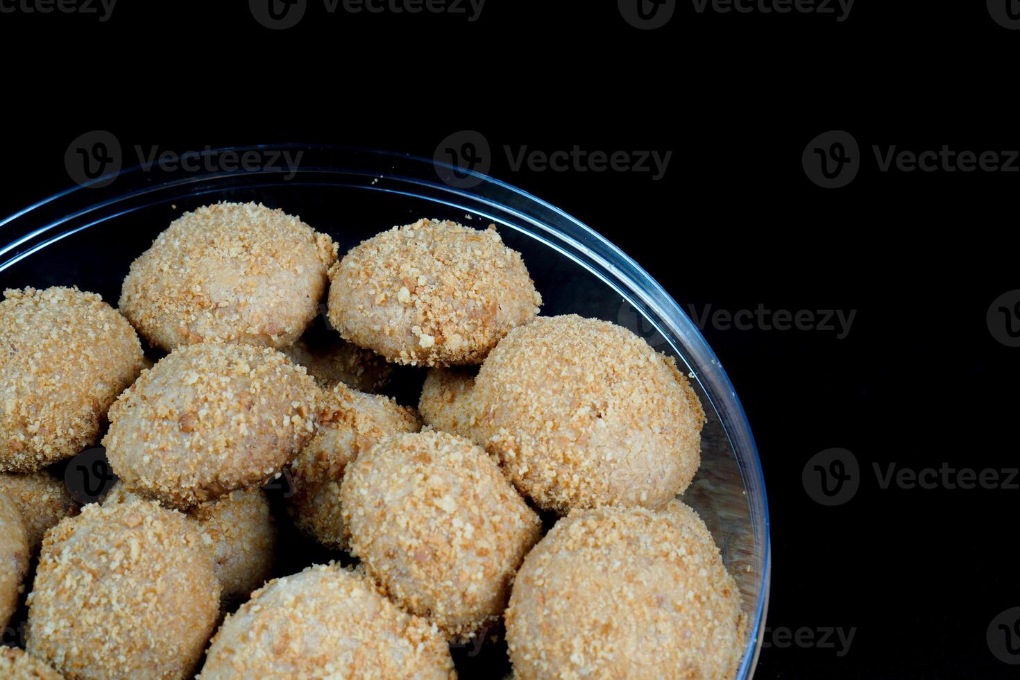 close up view of a beautiful chestnut cake on a black background. photo