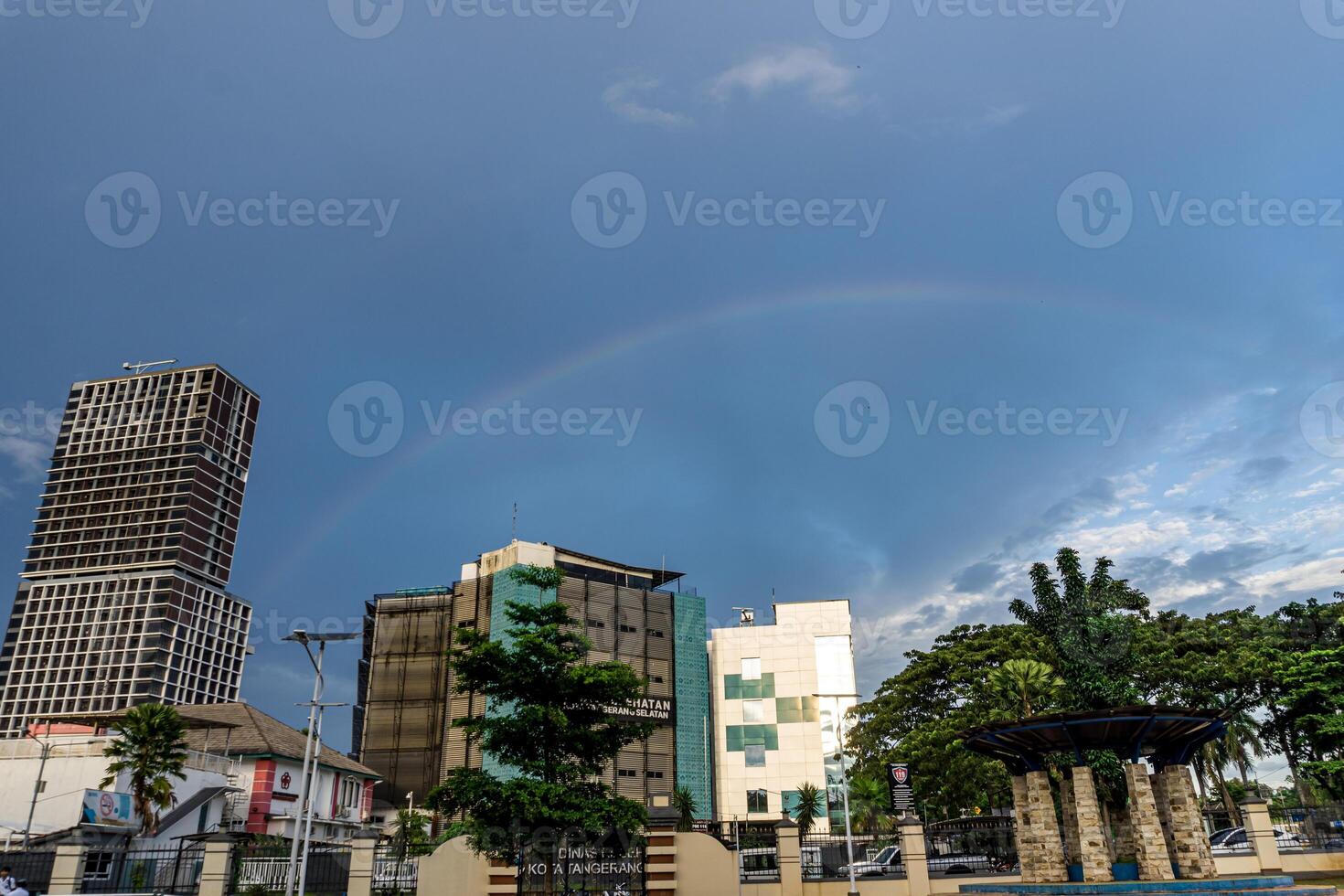 skyscrapers with a beautiful rainbow background photo